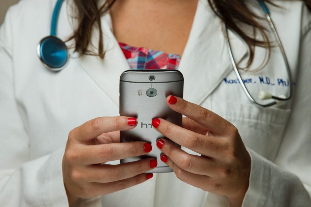 woman with phone, telehealth