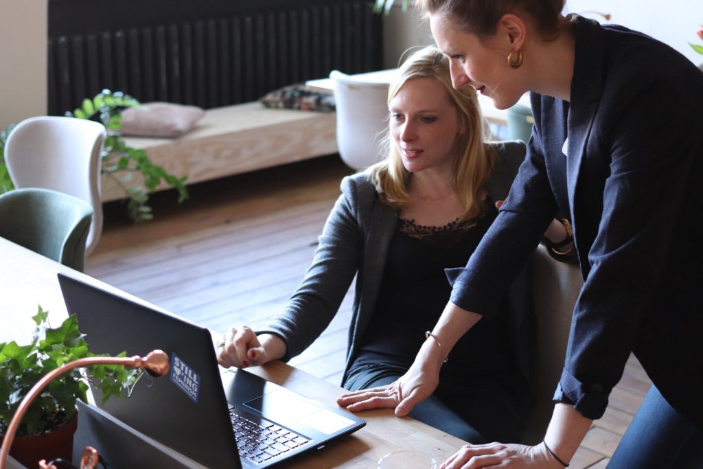 women in office with laptop