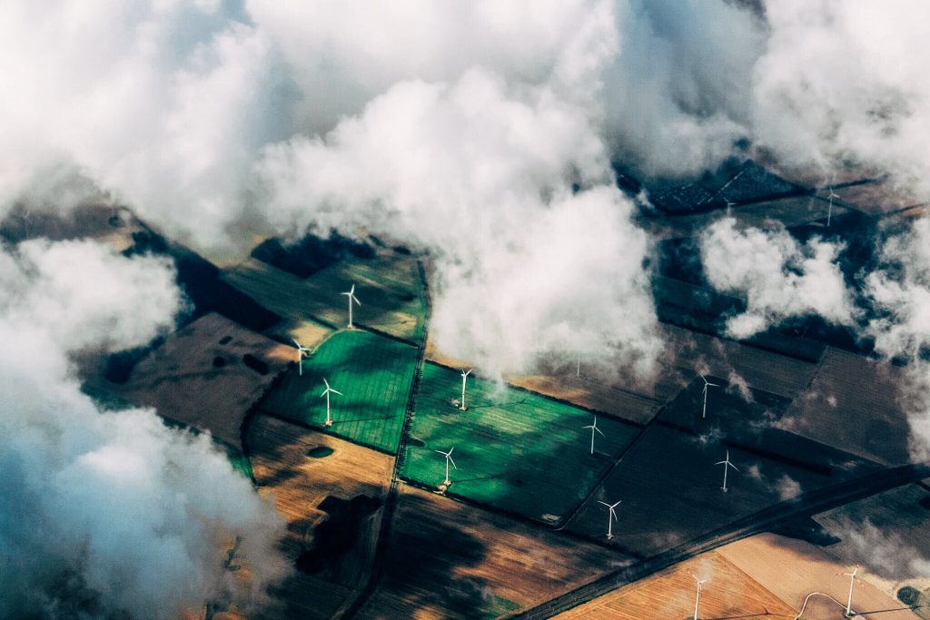 wind energy turbines under clouds